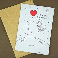 a card that says i love you to the moon and back with an astronaut on it