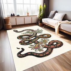 a large rug with a snake on it in a living room next to a couch