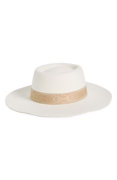 A wide brim and dented crown defines a classic boater hat crafted from felty fabric and finished with a novelty hat band. Textile Spot clean Imported Elegant White Fedora With Flat Crown, Elegant Cream Hat With Flat Crown, Cream Felt Hat With Short Brim For Rodeo, White Wide Brim Felt Hat For Rodeo, White Wide Brim Rigid Hat, Elegant Cream Fedora With Flat Crown, Chic White Hat With Flat Crown, Elegant White Hat With Flat Crown, White Boater Hat With Flat Crown For Spring