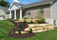 a house with landscaping in front of it