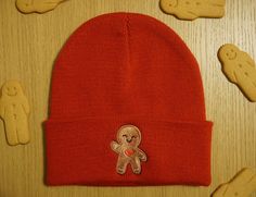 a gingerbread man hat sitting on top of a wooden table