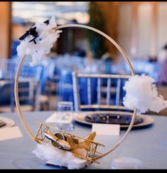 a small model airplane on top of a table in a room filled with tables and chairs