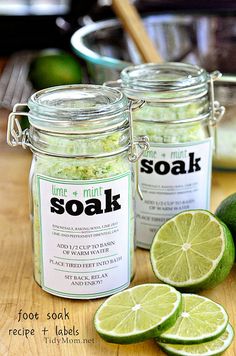 lime and mint soak in jars on a cutting board next to sliced limes