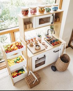 a toy kitchen with lots of food in it