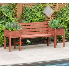 a wooden bench sitting next to a pool with plants growing on it's sides