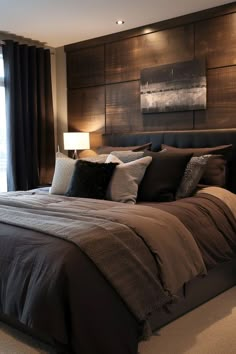 a bedroom with a large bed and wooden headboard