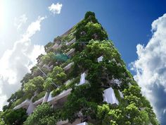 a very tall building with lots of trees growing on it