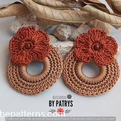 the earrings are made out of woven and have flowers on them