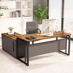 an office desk with a laptop computer sitting on top of it