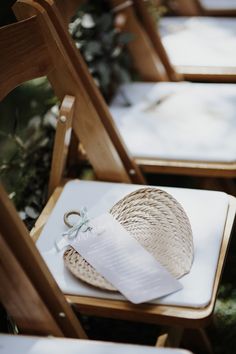 the chairs are lined up with paper on them