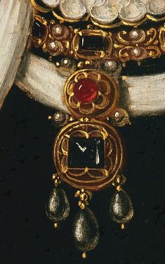 a close up of a painting with jewelry on it