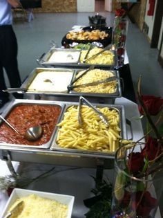 a buffet line with many different types of food