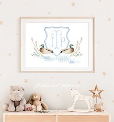 two ducks sitting on top of a dresser next to a teddy bear and star wall decal