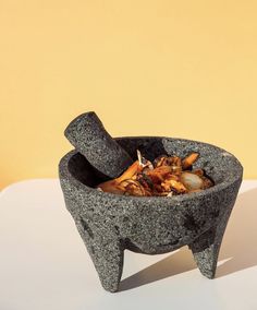 a bowl with food in it sitting on a table