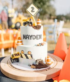 a construction themed birthday cake on a table