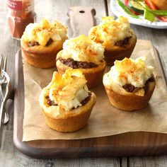 mini meat and cheese cups on a wooden tray