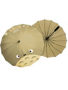 two umbrellas with faces drawn on them, one is brown and the other is beige