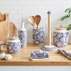 blue and white ceramic kitchen utensils on wooden counter