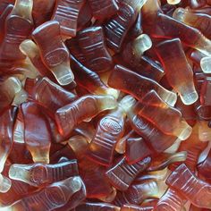 there are many pieces of gummy candy in the pile together, and one is red