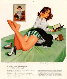 a woman laying on top of a bed next to a book and magazine with her legs crossed