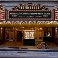 a bike parked in front of a theater