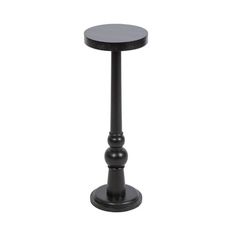 a small black table with two balls on it's legs and an iron base