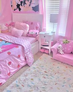 a bedroom decorated in pink and white with hello kitty bedding