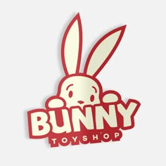 the bunny toy shop logo is red and white with an image of a rabbit on it