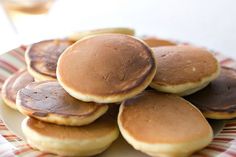 a plate full of pancakes sitting on top of a table