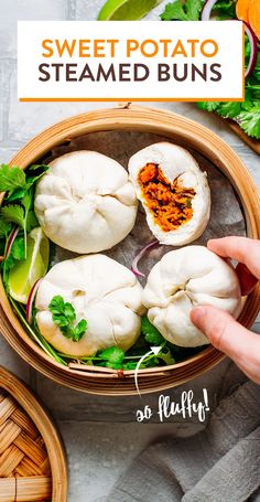 a person is holding up some steamed buns in a bowl with lettuce and other vegetables