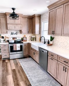 a kitchen with wooden cabinets and stainless steel appliances