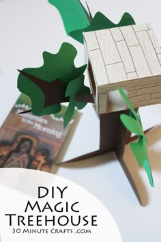 an origami tree house made out of wood and paper with the words diy magic treehouse on it