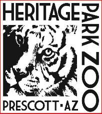 a black and white image of a tiger with the words heritage park zoo on it