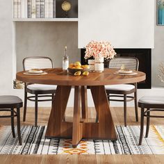 a wooden table with chairs around it in front of a fire place and bookshelf