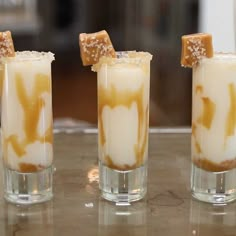 three glasses filled with different types of drinks