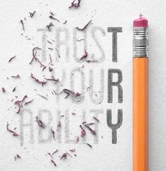 the words trust your ability written with pencils