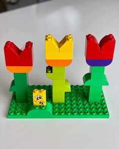 the legos are made to look like they have flowers on top of each other