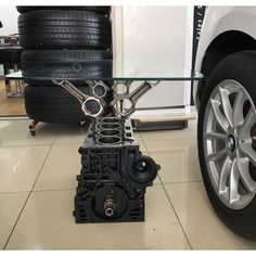 a car engine sitting under a glass table