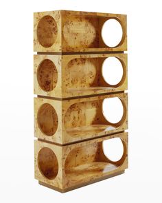 three wooden boxes stacked on top of each other with holes in the bottom and sides