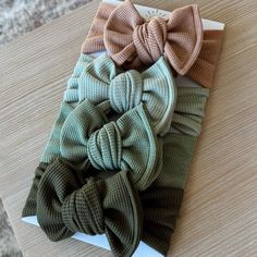 four bows are sitting on top of each other