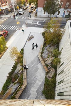 an aerial view of people walking down the street