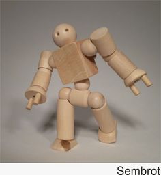 a wooden toy holding a piece of wood