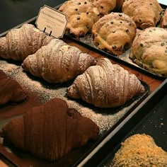 baked goods displayed on trays in display case