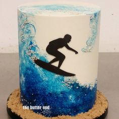 a decorated cake with a surfer on it