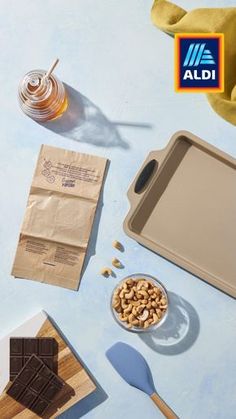 an assortment of food on a table including chocolate, peanut butter and honeycombs