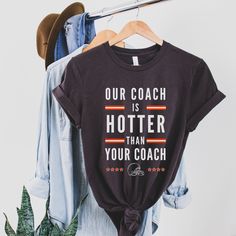 Looking for a sweatshirt version? https://www.etsy.com/listing/1082523414/our-coach-is-hotter-than-your-coach ★ PRODUCT INFORMATION - Unisex relaxed fit - 100% combed ring-spun cotton - Pre-shrunk fabric - Side-seamed construction - Shoulder-to-shoulder taping - Direct to garment printing (not screen printed) ★ SIZING We recommend laying out your favorite top and comparing the measurements to the sizing chart. These are a unisex fit. Ladies, if you would like something fitted, we recommend sizin Football Aesthetics, Coach Shirt, Coach Shirts, Oversized T Shirt Dress, Classic Football, Distressed Shirt, Football Tees, Cleveland Browns, Sizing Chart