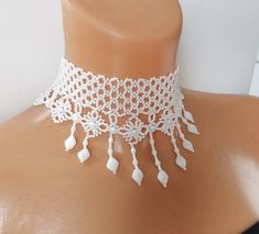 WHITE FANTASY choker with matching earrings that will fit graciously on your neck. This light and delicate set will give you astonishing looks and refined sensation.  * Necklaces lenght - 33 cm (12.99 inches) + with extension * Necklace  width -  4 cm (1.57 inches) * Material : glass Czech beads * Color: white * The number: K17031 To make it as a perfect gift, we send our items in a small gift boxes and a matching ribbon. Pendants, rivière and necklaces are made by mixing various techniques of bead weaving. Each hand made piece is developed with love, passion and extreme attention to detail.  I kindly ask you to read my shop policies before purchasing: https://www.etsy.com/shop/ARTMENAbeads#policies If you have any questions regarding an item, please feel free to contact us!  Thanks for vi Delicate White Adjustable Jewelry, White Pearl Choker Jewelry, White Necklace For Festivals, Delicate White Choker Jewelry, Delicate White Choker Necklace, Pearl White Adjustable Choker For Party, White Dainty Jewelry With Dangling Beads, Dainty White Beaded Necklace For Festivals, White Choker Jewelry For Gift