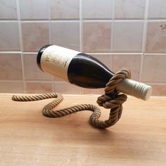 a wine bottle is wrapped in a rope