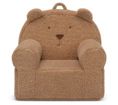 a brown teddy bear chair sitting on top of a white floor