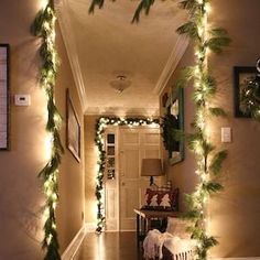 the hallway is decorated for christmas with garlands and lights